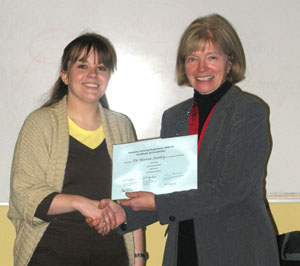 Dr Alanna Stanley receiving her Certificate of Completion from Emeritus